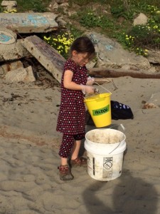 Melina cleans the beach